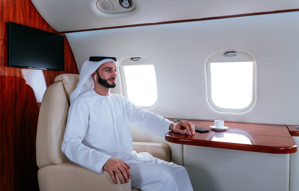 Business man flying on private jet