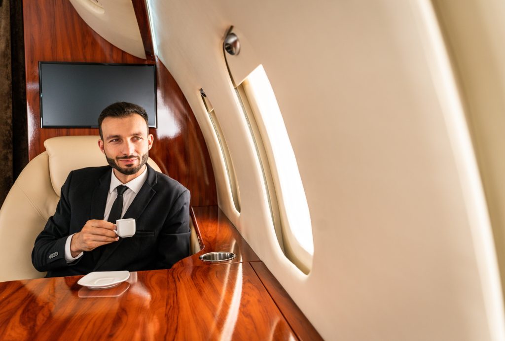 Businessman flying on private jet